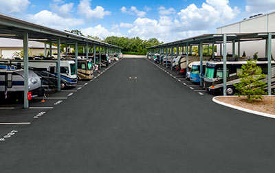 Outdoor parking for vehicles including RVs, boats, and cars.