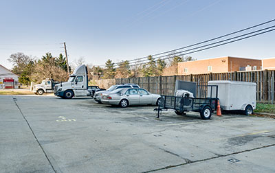 Outdoor parking for vehicles including RVs, boats, and cars.